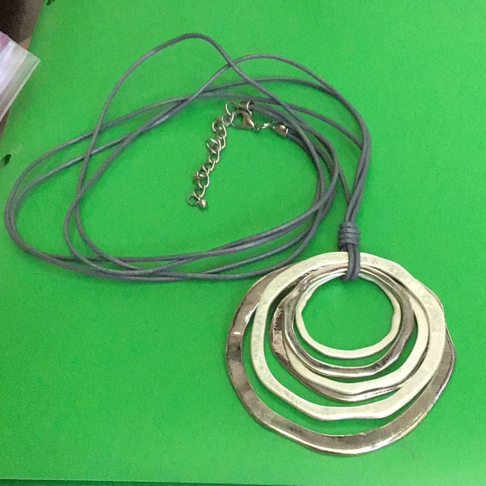 Longer silver tone pendant necklace